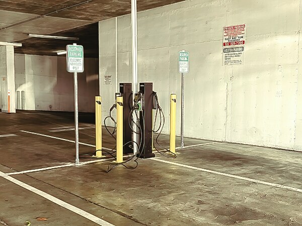 Car charging stations in Gateview garage without protection for battery fires.