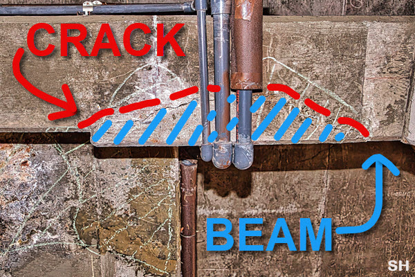 An image of the cracked garage beam supporting the pool.