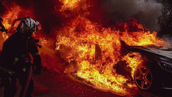 Photo of electric vehicle in a Korean parking garage totally engulfed in battery fire flames, which damaged 140 cars and 23 people.